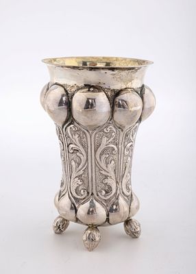 A SILVER GERMAN KIDDUSH CUP C. 1900. Germany, c. 1900. On three balled feet. With outwardly 
