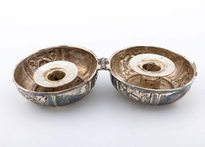 A SET OF SILVER TRAVELING SABBATH CANDLE HOLDERS. In the shape of a yo-yo. Clam structure that 