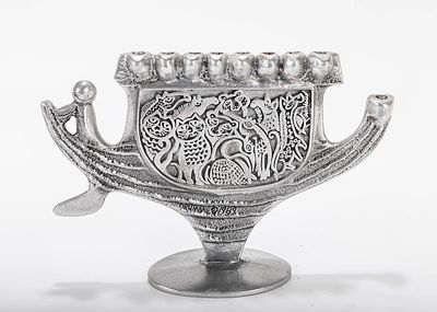 A ALUMINUM MENORAH SCULPTURE BY DON DRUMM (American, b. 1935). With an ark shaped base,. A 