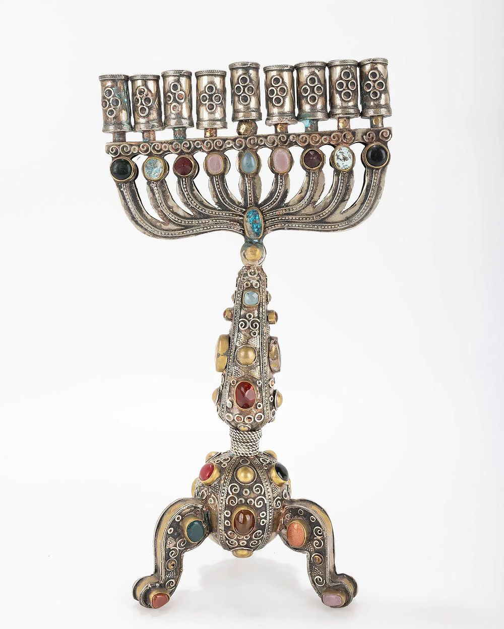 A LARGE HANUKKAH MENORAH. Probably Israel, Modern. With a gilded body and applied stones, metal 