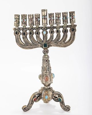A LARGE HANUKKAH MENORAH. Probably Israel, Modern. With a gilded body and applied stones, metal 