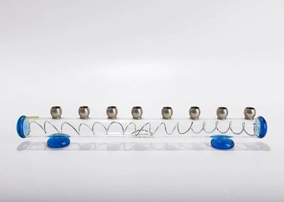 A GLASS HANUKAH LAMP BY HOSHEN. Israel, 20th century. Made of tubular glass with 9 candle 