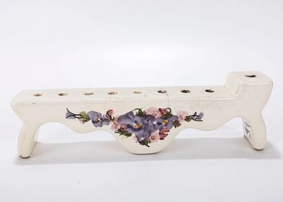 A CERAMIC HANUKKAH LAMP. Probably Israel. c. 1990. Hand painted with flowers. 10 inches wide. signed