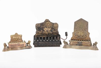 A GROUP OF THREE HANUKKAH LAMPS. Probably Israel, modern. In Bezalel style. The largest is 7” wide.