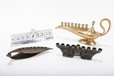 A GROUP OF FOUR HANUKKAH LAMPS. Probably Israel, modern. Each one of a different design.The 