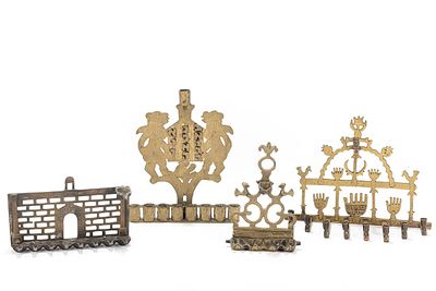 A GROUP OF FOUR BRASS HANUKKAH LAMPS. Probably Israel. Each one of a different design. The 