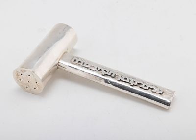 A STERLING SILVER SALT SHAKER BY BIER. Israel, c. 1990. In the form of a hammer. Hand hammered 