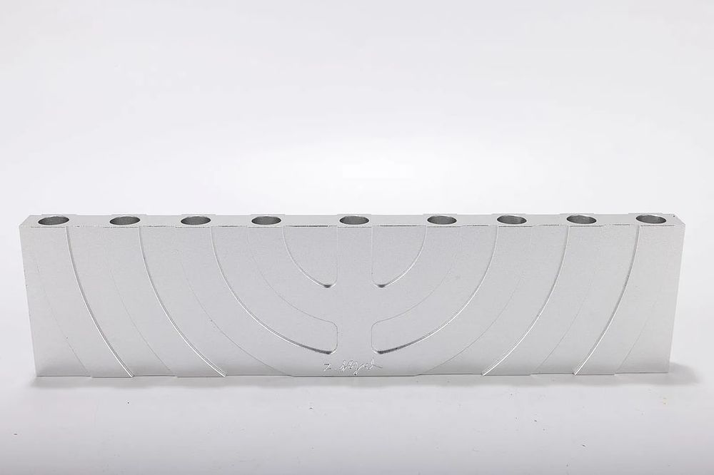 AN ALUMINUM HANUKKAH MENORAH BY ZELIG SEGAL 1933-2015 . Israel. AN ALUMINUM HANUKKAH MENORAH BY 