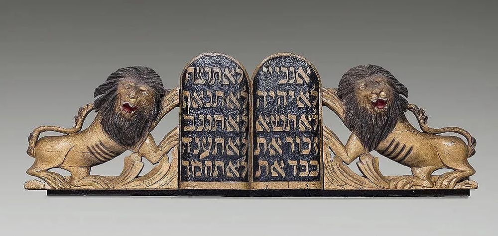 A LARGE PAIR OF HAND CARVED WOODEN LIONS FROM AN ARON KODESH. United States, c. 1900. The lions 