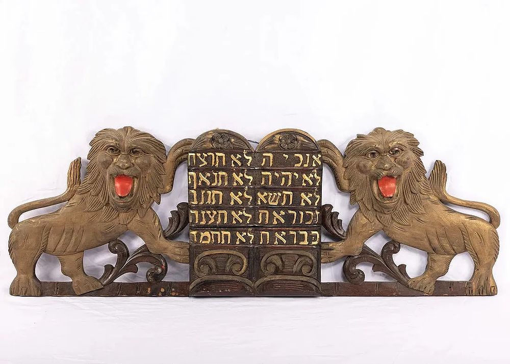 A SET OF SYNAGOGUE LIONS FROM THE TOP OF AN ARON KODESH. American, c. 1920. Two lions flanking 