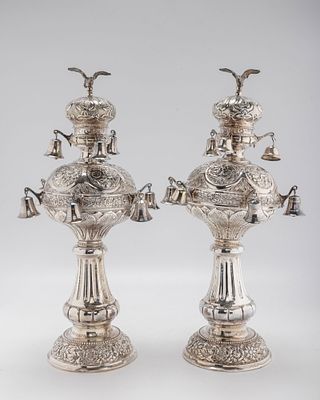 A PAIR OF LARGE SILVER TORAH FINIALS. Hungary, early 20th century. On round chased bases with 