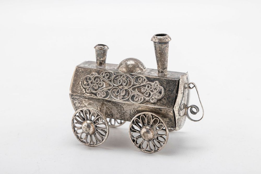 A STERLING SILVER SPICE CONTAINER. Probably Israel. In the shape of a small antique locomotive. 