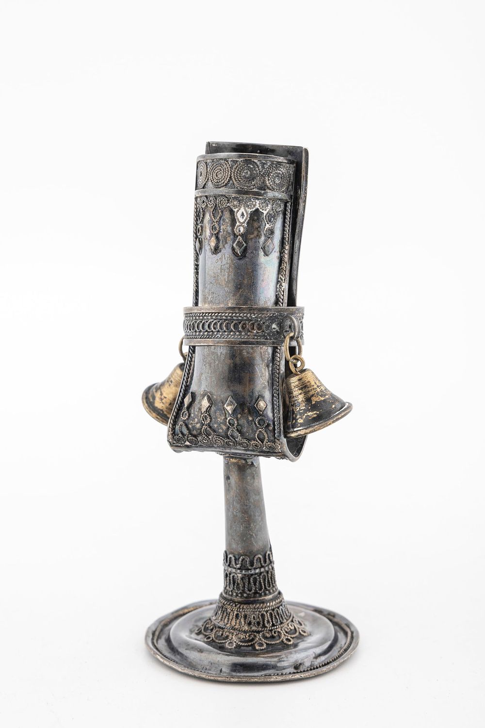 A STERLING SILVER HAVDALLAH CANDLE HOLDER BY THE BEZALEL SCHOOL. Israel, C. 1950. On a round 