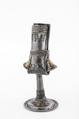 A STERLING SILVER HAVDALLAH CANDLE HOLDER BY THE BEZALEL SCHOOL. Israel, C. 1950. On a round 