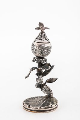 A SMALL SILVER SPICE POMANDER. Modern. On a shell base with many leafs decorating the rising 