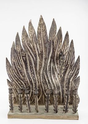 A HANDMADE HANUKKAH LAMP BY S.M. SHALY. Jerusalem, c. 1990. Hand wrought. In the shape of flame. 