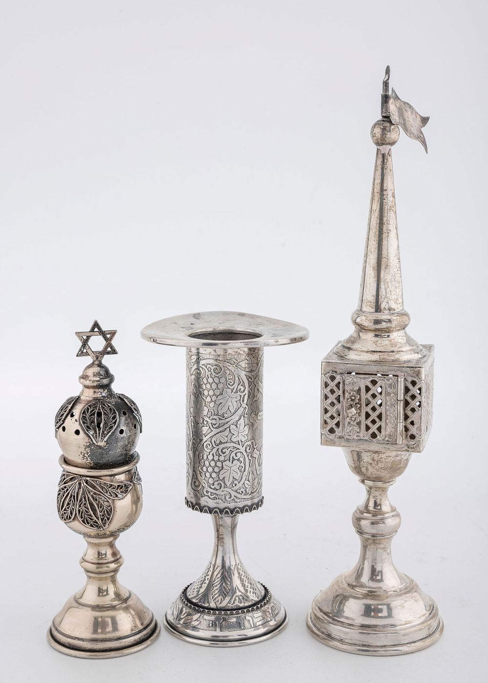 A GROUP OF TWO STERLING SILVER SPICE BOXES AND A CANDLE HOLDER. Israel and American, late 20th 