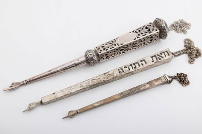 A GROUP OF THREE STERLING SILVER TORAH POINTERS. American, 20th century. The largest (10.7") in 