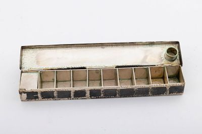 A STERLING SILVER TRAVELLING HANUKKAH LAMP. American, 20th century. Rectangular in form. 