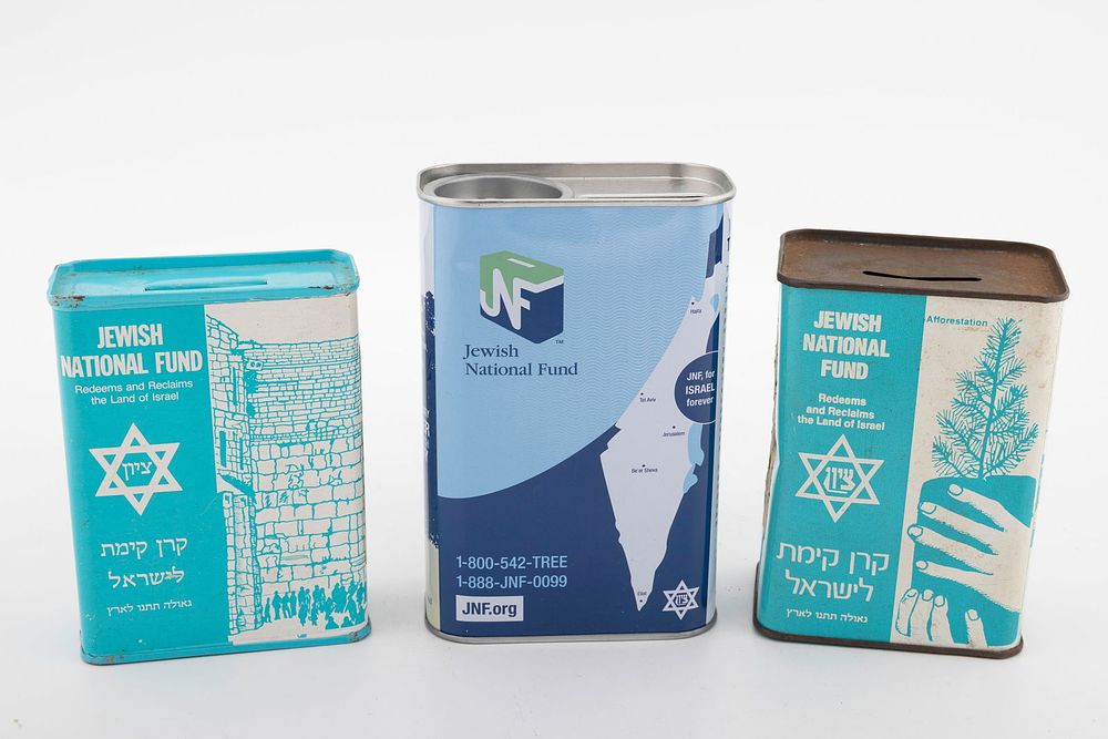A GROUP OF JEWISH NATIONAL FUND CHARITY CONTAINERS. Including two vintage models, one depicting 