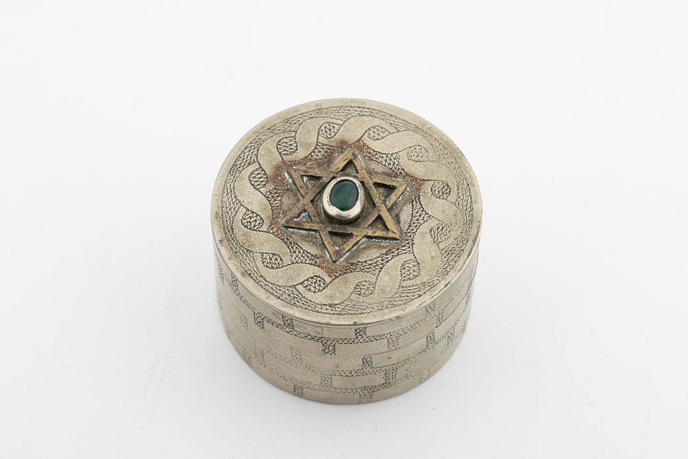 A TRAVELLING CIRCULAR HANUKKAH LAMP. Israel, modern. Alpacca. Formerly a pill box of sort. 