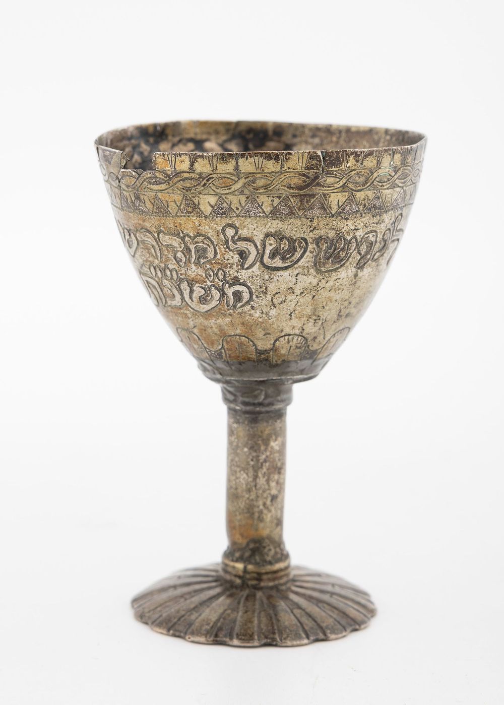A RARE SEPHARDIC SILVER KIDDUSH CUP. In goblet form. Chased with a dedication dating to 1853. 