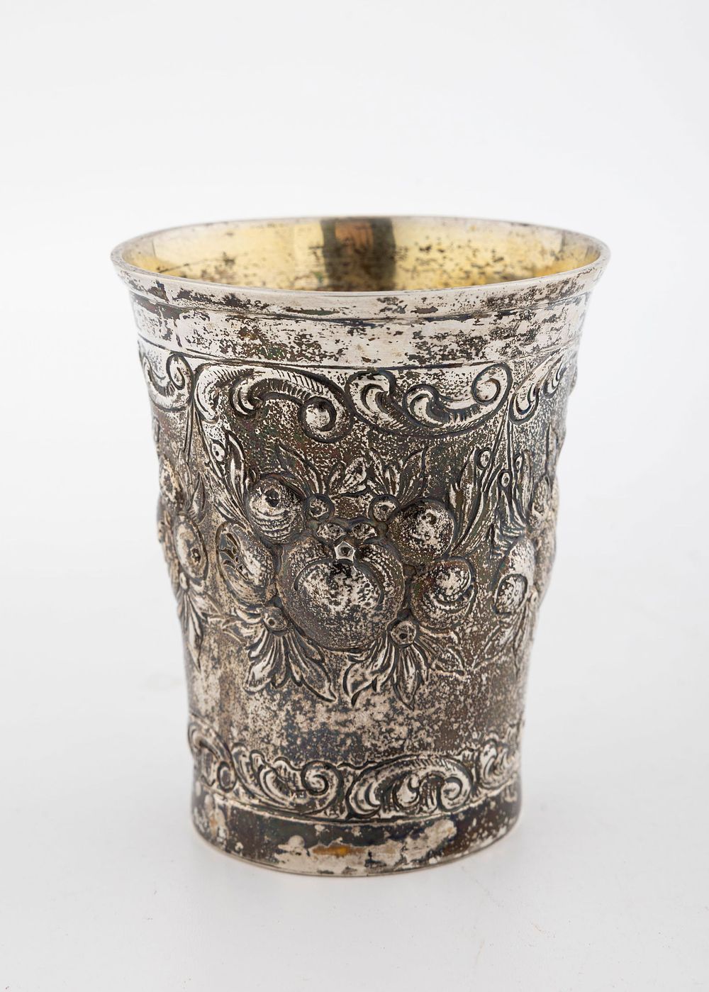 A SILVER KIDDUSH CUP. Germany, c. 1880. Embossed with pomegranates and other fruits. Interior 