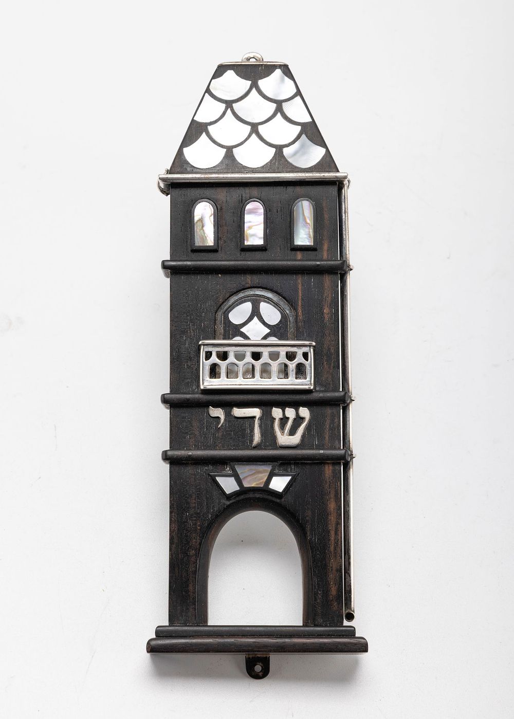 FINE EBONY AND SILVER MEZUZAH BY CATRIEL SUGARMAN. Jerusalem. 1986.Hand made in the form of the 