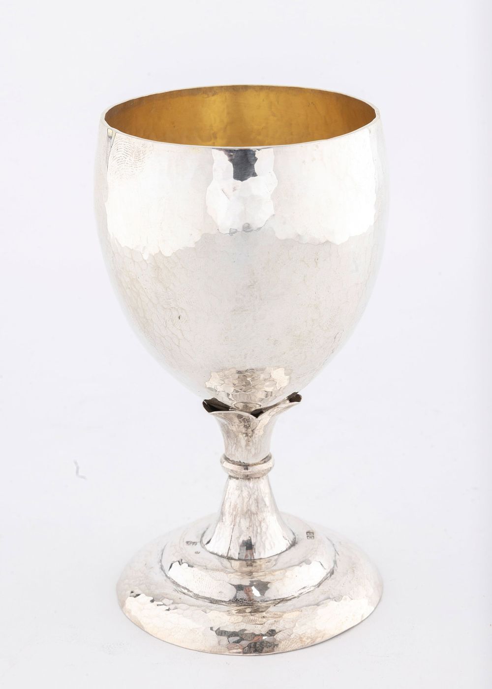A HAND WROUGHT STERLING SILVER KIDDUSH CUP BY DOVID COHEN. Jerusalem, modern. On a domed base 