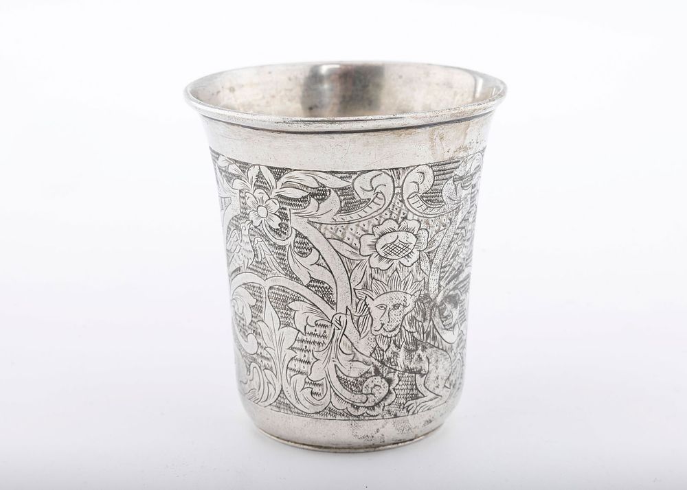 A SILVER KIDDUSH CUP. Ukraine, c. 1820. Beaker form. Engraved with floral designs, multiple 