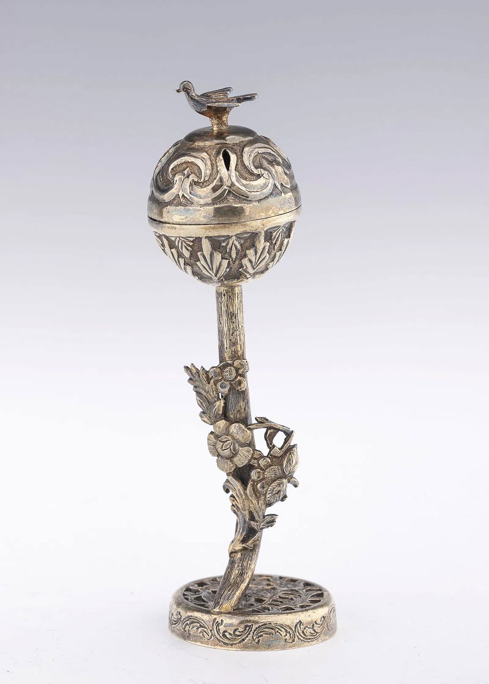 A SILVER SPICE CONTAINER. Probably China, c. 1890. On a round lattice work base with elongated 