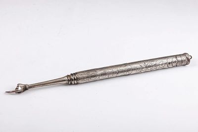 A SILVER TORAH POINTER. Continental, 19th century. Of heavy form. Hand engraved with flowing 