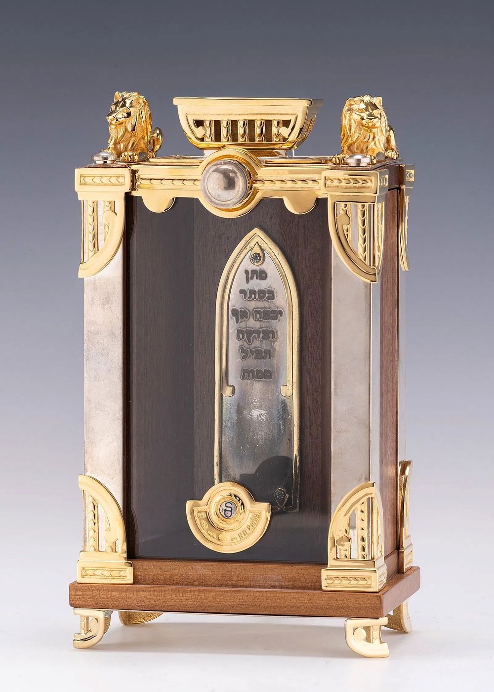 SWED MASTER SILVERSMITHS. (Jerusalem, c.2000) SILVER AND WOOD CHARITY CONTAINER. On four gilded 