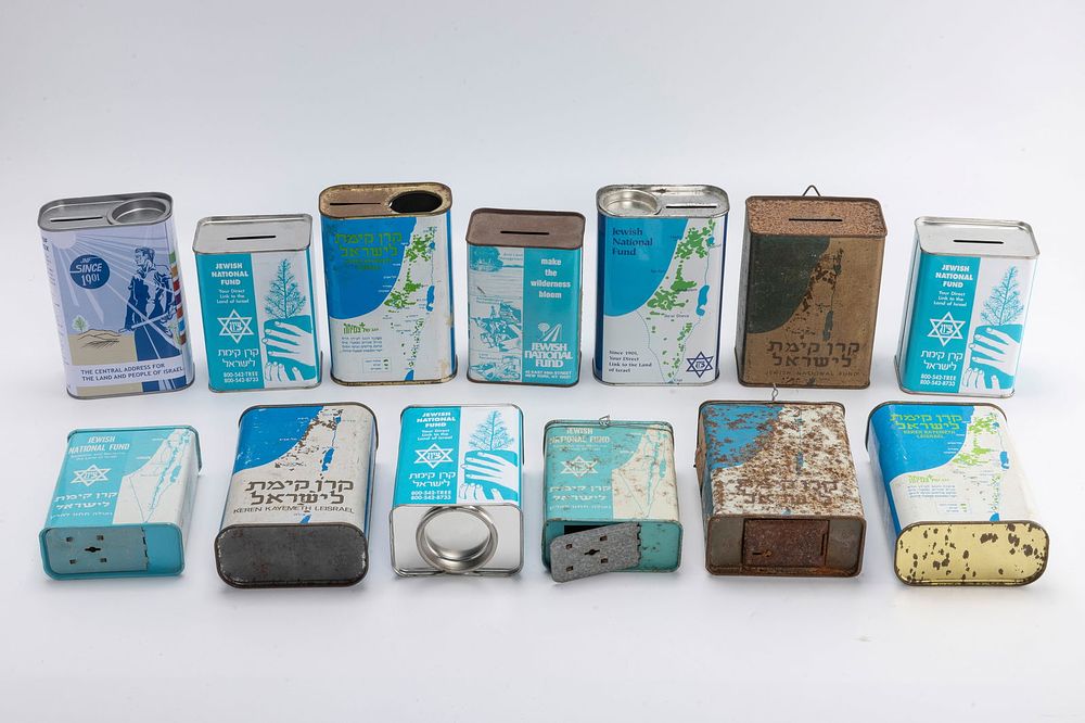A GROUP OF 13 JEWISH NATIONAL FUND CHARITY CONTAINERS. Spanning 1920 - 1990. Various countries 