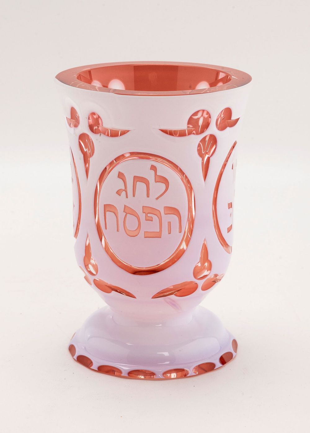 A LARGE RUBY GLASS PASSOVER GOBLET. Probably Italian, Early 20th century. With a white outer 
