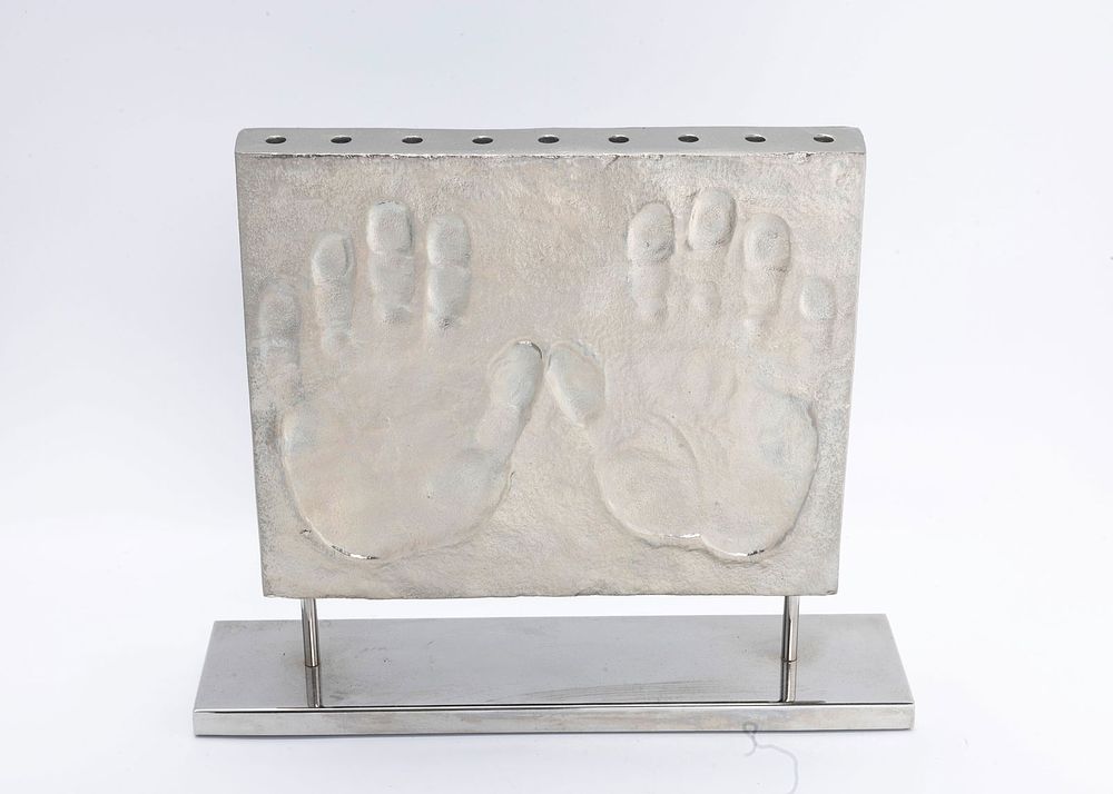 A MODERN CHROME HANUKKAH MENORAH BY MICHAEL ARAM. 2011. Modern form. Signed 38/500 and dated 