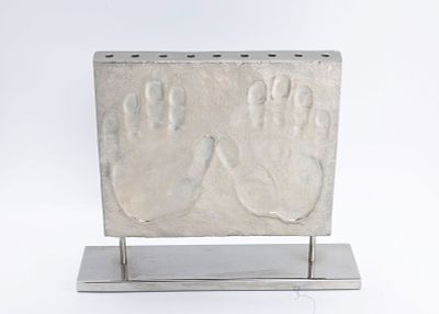 A MODERN CHROME HANUKKAH MENORAH BY MICHAEL ARAM. 2011. Modern form. Signed 38/500 and dated 