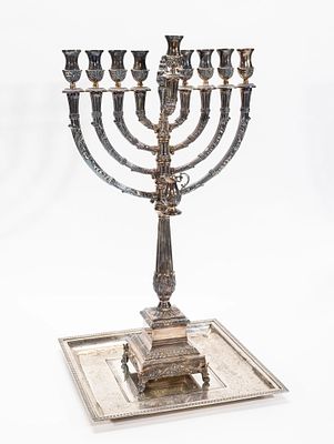 A STERLING SILVER HANUKKAH MENORAH AND UNDERTRAY. Israel. The menorah by Hazorfim is 23.8" tall 