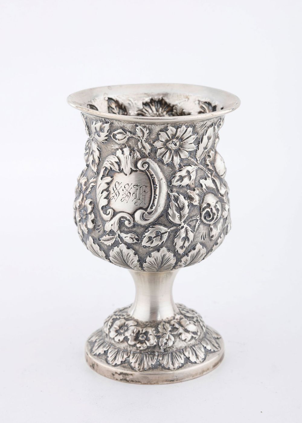 A STERLING SILVER REPOUSEE GOBLET BY STEIFF. On a hand embossed base with a large upper portion. 