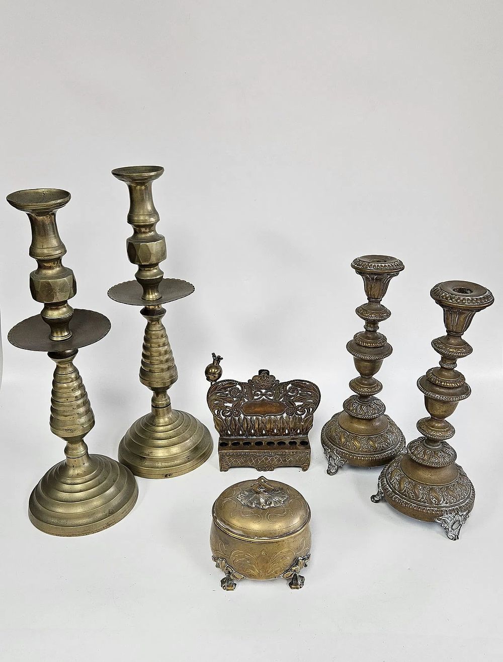 A MASSIVE PAIR OF BRASS CANDLESTICKS AND A HANUKKAH MENORAH. Continental and Europe. Includes a 