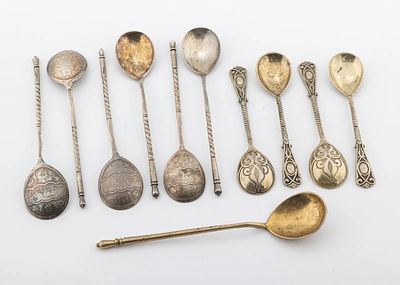 A GROUP OF SILVER APOSTLE SPOONS. Seven Russian with sharp hand engraving dated 1888 5" and5.4". 
