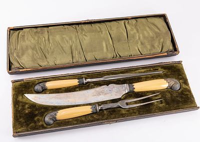 A LARGE BAKELITE AND STEEL CARVING SET. Sheffield. Manufactured by Parkin and Marshall, in 