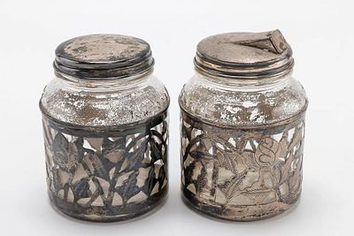 A PAIR OF STERLING SILVER AND GLASS COVERED JARS. Mexico, mid-century. Glass jars with sterling 