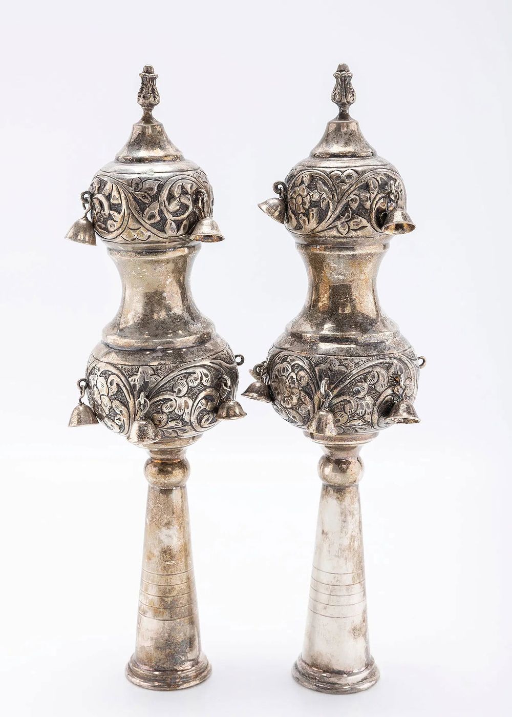 A PAIR OF STERLING SILVER TORAH FINIALS. Israel, modern. Hand chased in bulbous form. Fitted 