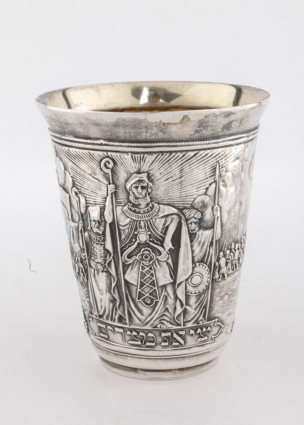 A STERLING SILVER PASSOVER CUP BY HENRYK WINOGRAD. New York, 1991. Decorated with scenes of the 