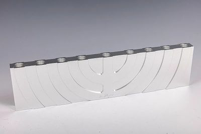 AN ALUMINUM HANUKKAH LAMP AND SABBATH LAMP SCULPTURE BY ZELIG SEGAL. Israel, c. 1990. 