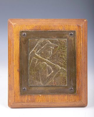 AN EARLY BEZALEL PLAQUE OF THE CHALUTZ . Jerusalem, c. 1920. Depicts a young man about to work 