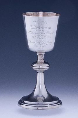 A LARGE WHITE METAL SYNAGOGUE KIDDUSH GOBLET BY GORHAM. American, 1908. Engraved Presented to 