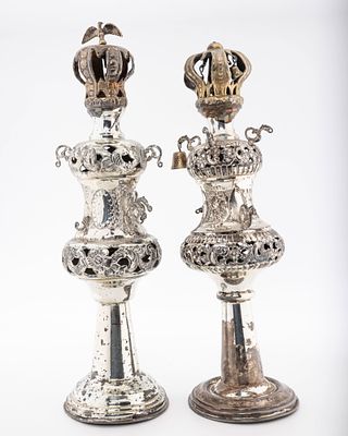 A PAIR OF STERLING SILVER TORAH FINIALS. American, c. 1920. On round bases in traditional form. 
