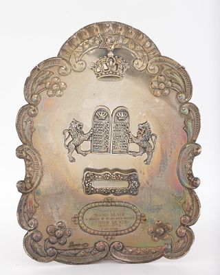 A STERLING SILVER TORAH SHIELD. American, c. 1970. Traditional form. With dedicatory 
